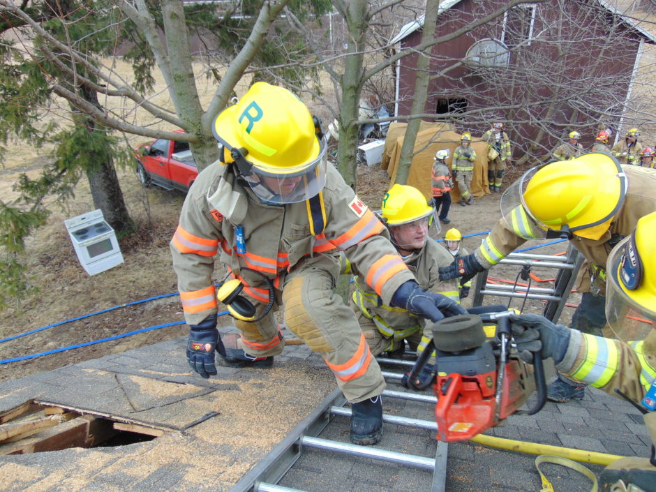 firefighters training on a roof
